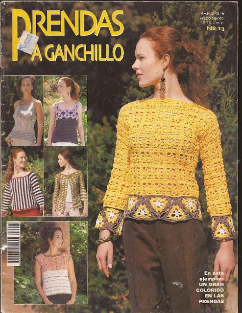 "Portada de la revista 'Prendas a Ganchillo' número 13. Mujer pelirroja con blusa amarilla de ganchillo con detalles en granny squares púrpuras y amarillos, posando al aire libre. A la izquierda, cinco fotografías más pequeñas muestran diferentes tops y suéteres de ganchillo con diseños coloridos. Texto: 'En este ejemplar: un gran colorido en las prendas'. Precio en euros, México y número de edición."